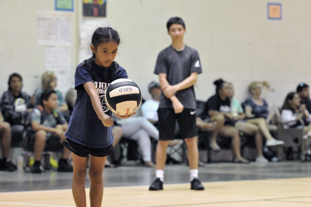 PAL volleyball. GIrl serving.