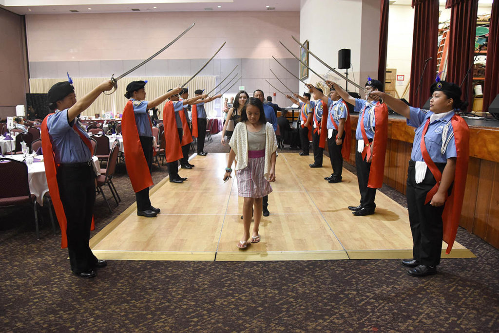 HPD's Law Enforcement Explorers creating an Arch of Sabers at the DARE dinner