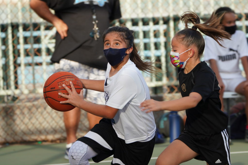 PAL Basketball. Girl driving towards the basket