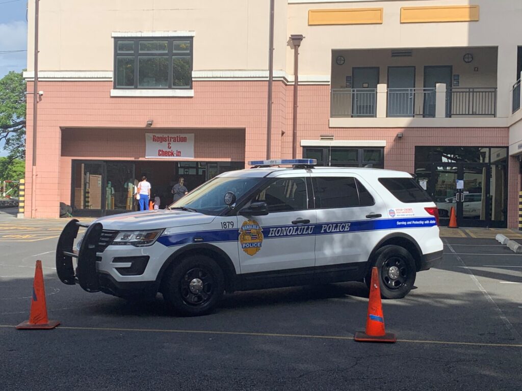 marked hpd vehicle in front of a building
