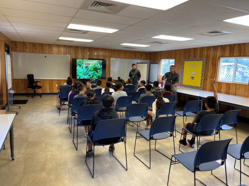 Officers presenting substance abuse to kids