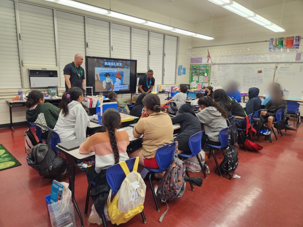 Officers educating students about internet safety
