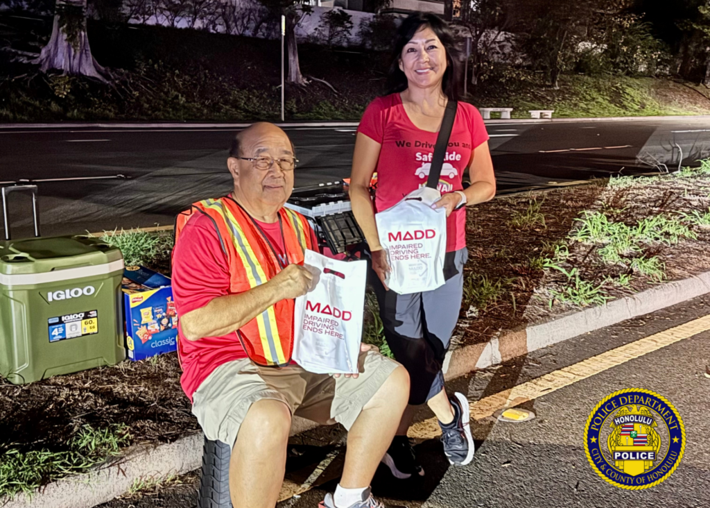 Traffic Division Honors Azalia Park with Sign-Waving and Checkpoint. Over the weekend, officers from the Traffic Division partnered with SafeRide Hawaiʻi, MADD Hawaiʻi, and the Keiki Injury Prevention Coalition Hawaiʻi for a sign-waving event in remembrance of Azalia Park, a victim of impaired driving in December 2020. Officers then conducted a sobriety checkpoint in the area, where sober drivers were thanked with a gift from MADD Hawaiʻi for choosing to drive sober. 🚗💙 Remember, making good decisions affects us all and helps ensure safer roads for everyone. 🌟 #SaferRoadsTogether #DriveWithAloha #SafeEveryMile