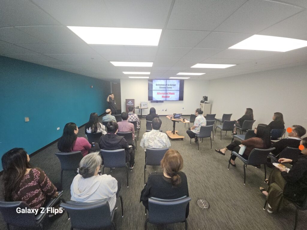 HPD Officers providing a safety presentation to employees.
