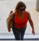Unknown female with sunglasses and a checkerboard slouchy hobo style tote shown on surveillance camera