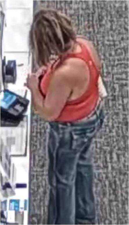 Unknown female with sunglasses and a checkerboard slouchy hobo style tote shown on surveillance camera