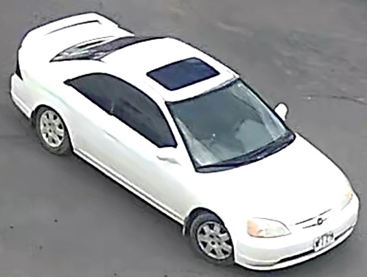 2-door Honda Civic with a sunroof and spoiler as shown on surveillance camera