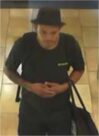 Unknown male wearing a bowler hat shown on surveillance camera