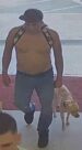 Unknown shirtless male with a leashed dog and unknown female carrying a sling bag captured on surveillance camera