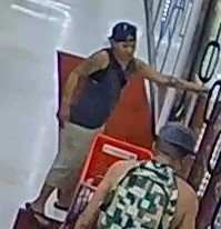 Unknown shirtless male with a leashed dog and unknown female carrying a sling bag captured on surveillance camera