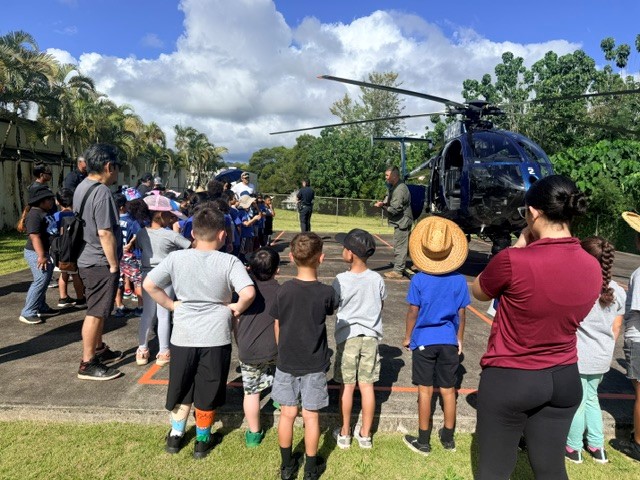 HPD's Pilot J. Nobriga gives a closer look at the Police Helicopter to Wahiawa Elementary' s First grade students