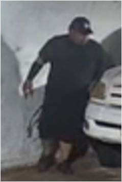 Unknown male suspect wearing a baseball cap as shown on surveillance camera