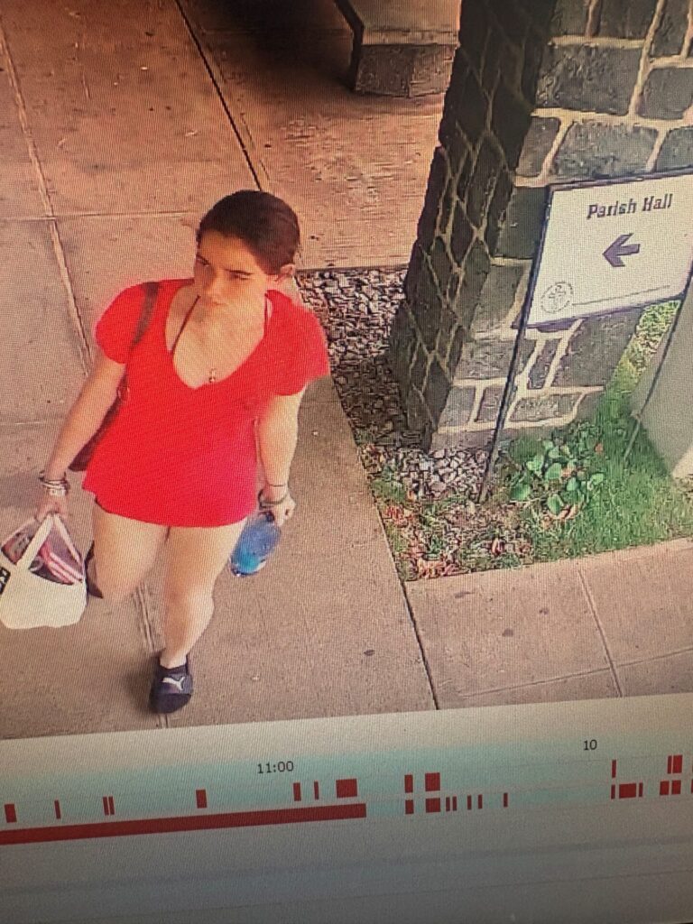 Unknown female wearing black socks and Puma slides as shown on surveillance video