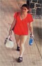 Unknown female wearing black socks and Puma slides as shown on surveillance video