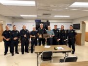 A group shot of Cpl. Jason Sarabia winning District 4's Employee of the First Quarter award. He is surrounded by HPD command staff.