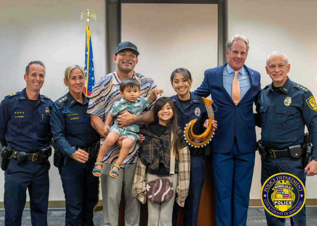 HPD Officer Roxanne Montalbo, pictured with HPD Capt. Marino Carreira, Acting Assistant Chief Gail Beckley, Officer Montalbo's husband and children, U.S. Attorney Kenneth M. Sorenson and Chief David Lazar, received Hawaiʻi's first Hometown Hero Award from the U.S. Department of Justice.