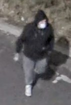 Unknown male suspect with a white face mask as shown on surveillance video