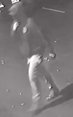 Unknown male suspect wearing a hoodie and baseball cap as shown on surveillance camera