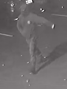 Unknown male suspect wearing a hoodie and baseball cap as shown on surveillance camera