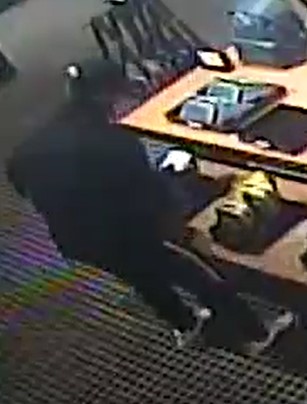 Unknown male wearing a sweatshirt, long athletic pants, and a Chicago Bulls hat as shown on surveillance camera