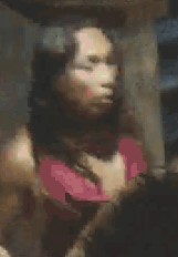 Barefoot individual in a halter-style backless dress as shown on surveillance camera