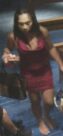 Barefoot individual in a halter-style backless dress as shown on surveillance camera
