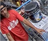 Unknown male suspect wearing a t-shirt with graphic print depicting the Hawaiian flag and Hawaiian island chain