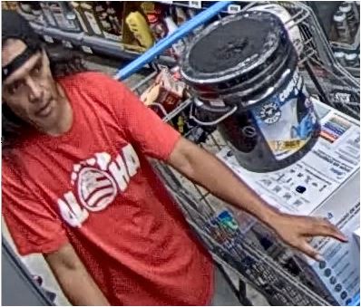 Unknown male suspect wearing a t-shirt with graphic print depicting the Hawaiian flag and Hawaiian island chain