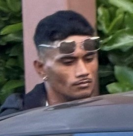 Unknown male suspect with an earring in his right earlobe and wire frame sunglasses as shown on surveillance camera