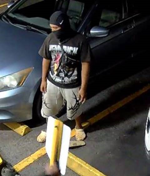 Unknown male suspect with a Nike brand balaclava and tribal graphic print shorts as shown on surveillance camera