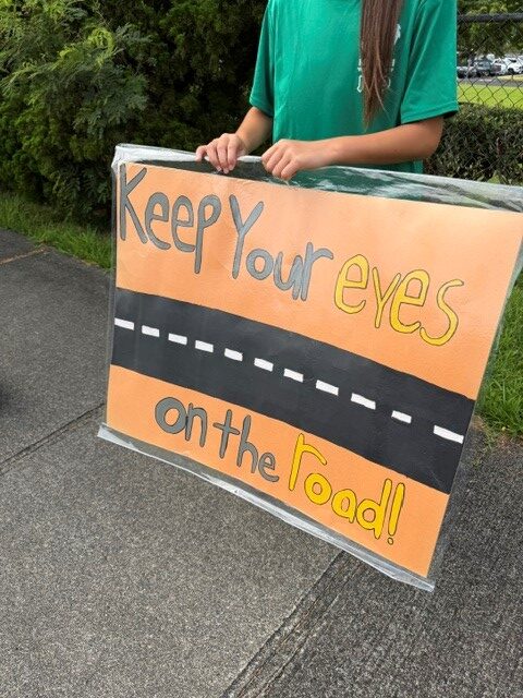 District 2 Officers alongside Mililani Ike students participated in sign waving to raise traffic safety awareness
