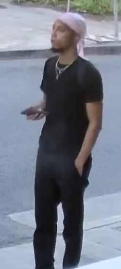 Unknown male suspect with a dark goatee and sideburns, wearing a durag as shown on surveillance camera