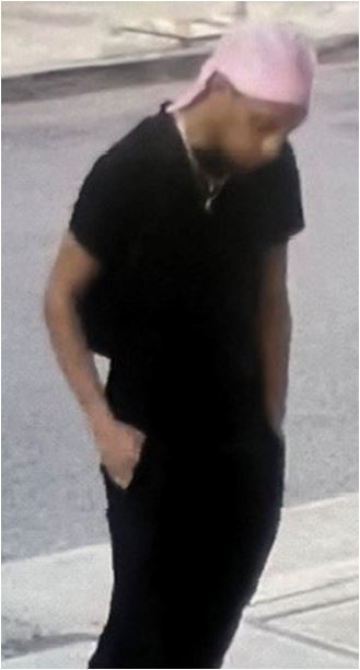 Unknown male suspect with a dark goatee and sideburns, wearing a durag as shown on surveillance camera