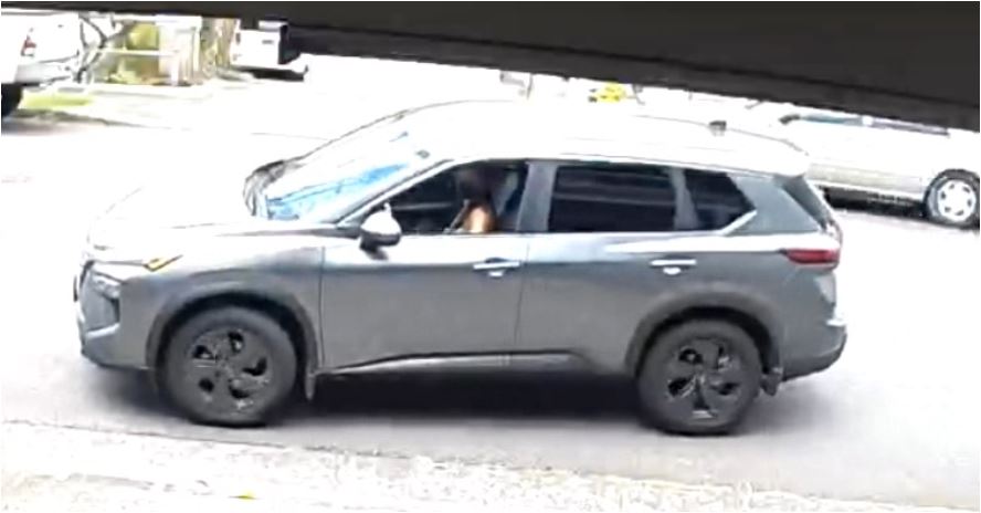 Gray Nissan SUV with black rims as shown on surveillance camera
