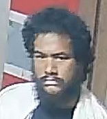 Unknown barefoot male suspect wearing a bath towel around his neck and medical wristband as shown on surveillance camera